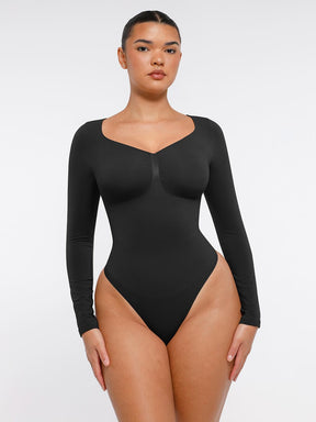 Body de tanga sin costuras de manga larga con soporte para el pecho y control medio