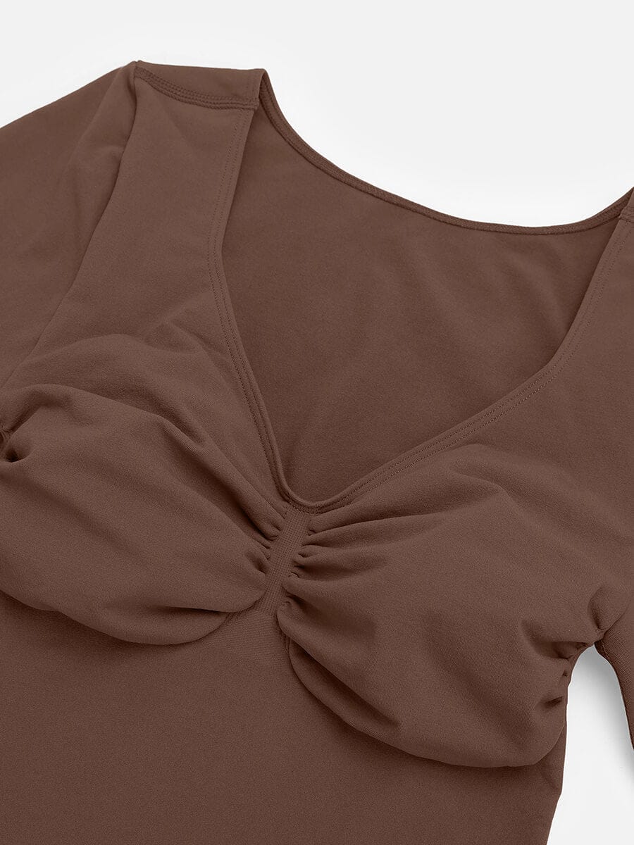 Body de tanga sin costuras de manga larga con soporte para el pecho y control medio