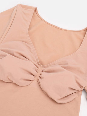 Body de tanga sin costuras de manga larga con soporte para el pecho y control medio